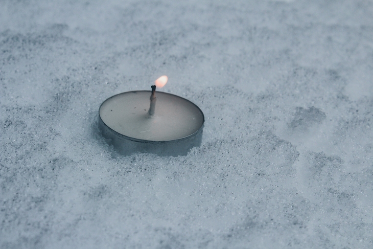A candle in the snow