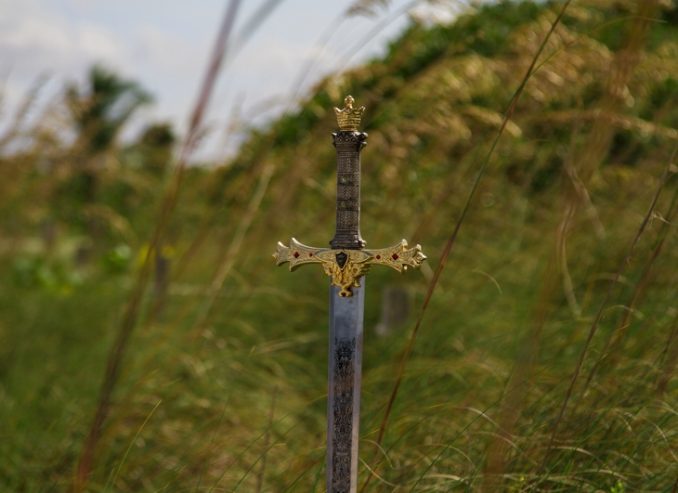 Sword in high grass